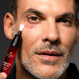 Man applying La Rey skincare eye gel to under-eye area, focusing on anti-aging and hydration for men’s skincare routine.