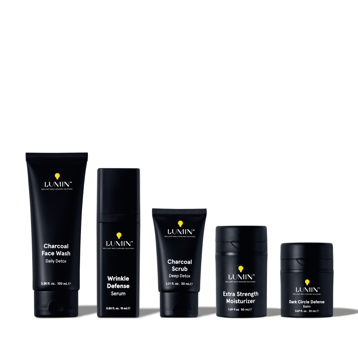 Lumin men's skincare set including charcoal face wash, wrinkle defense serum, charcoal scrub, extra strength moisturizer, and dark circle balm.