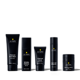 Lumin men's skincare set featuring charcoal face wash, wrinkle defense serum, charcoal scrub, super light moisturizer, and dark circle balm