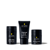 Lumin men's skincare set featuring Daily Face Moisturizer, Charcoal Scrub Deep Detox, and Dark Circle Defense Balm.