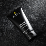 Lumin charcoal clay mask tube on textured dark surface, men's skincare detox face mask, 50ml packaging