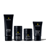 Lumin men's skincare set with Charcoal Face Wash, Daily Face Moisturizer, Dark Circle Defense Balm, and Charcoal Scrub.