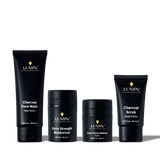 Lumin men's skincare set with Charcoal Face Wash, Extra Strength Moisturizer, Dark Circle Defense Balm, and Charcoal Scrub.