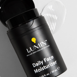 Lumin Daily Face Moisturizer black bottle with white cream swatch, men's skincare product, 50ml hydration lotion.
