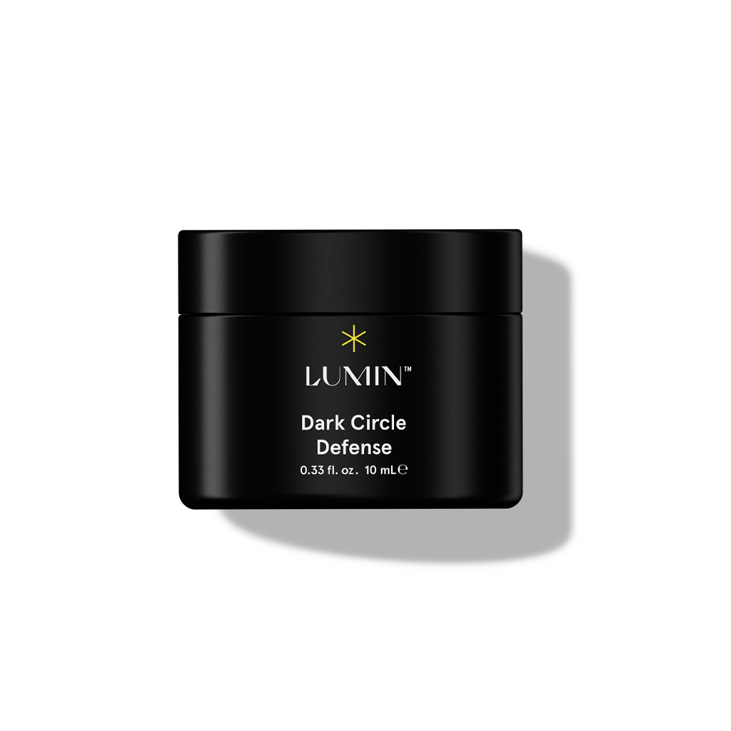 Lumin Dark Circle Defense eye cream jar, 10 mL, black container with yellow star logo for skincare and dark circle treatment.