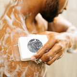 lumin pdp deep cleanse and scrub body bar in use 