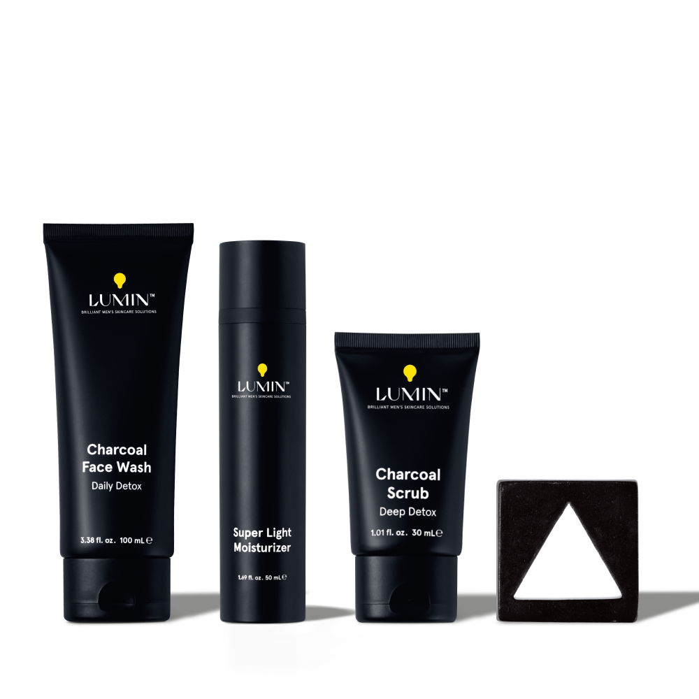 Lumin men's skincare set with charcoal face wash, super light moisturizer, charcoal scrub, and triangular black soap bar