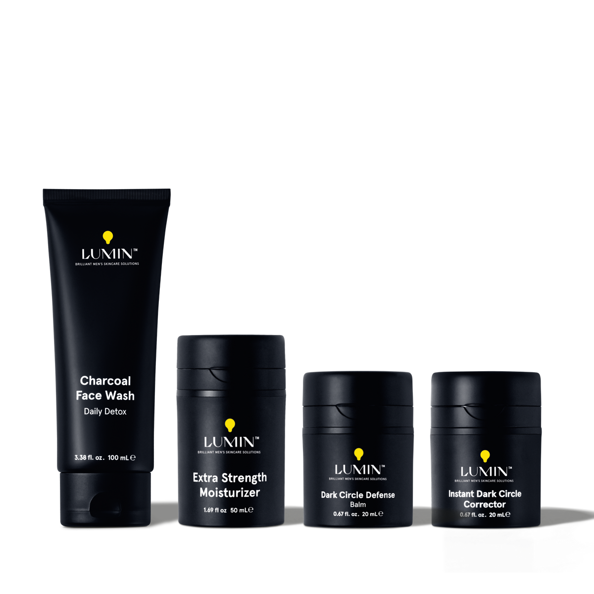 Lumin men's skincare set with charcoal face wash, extra strength moisturizer, dark circle defense balm, and corrector.
