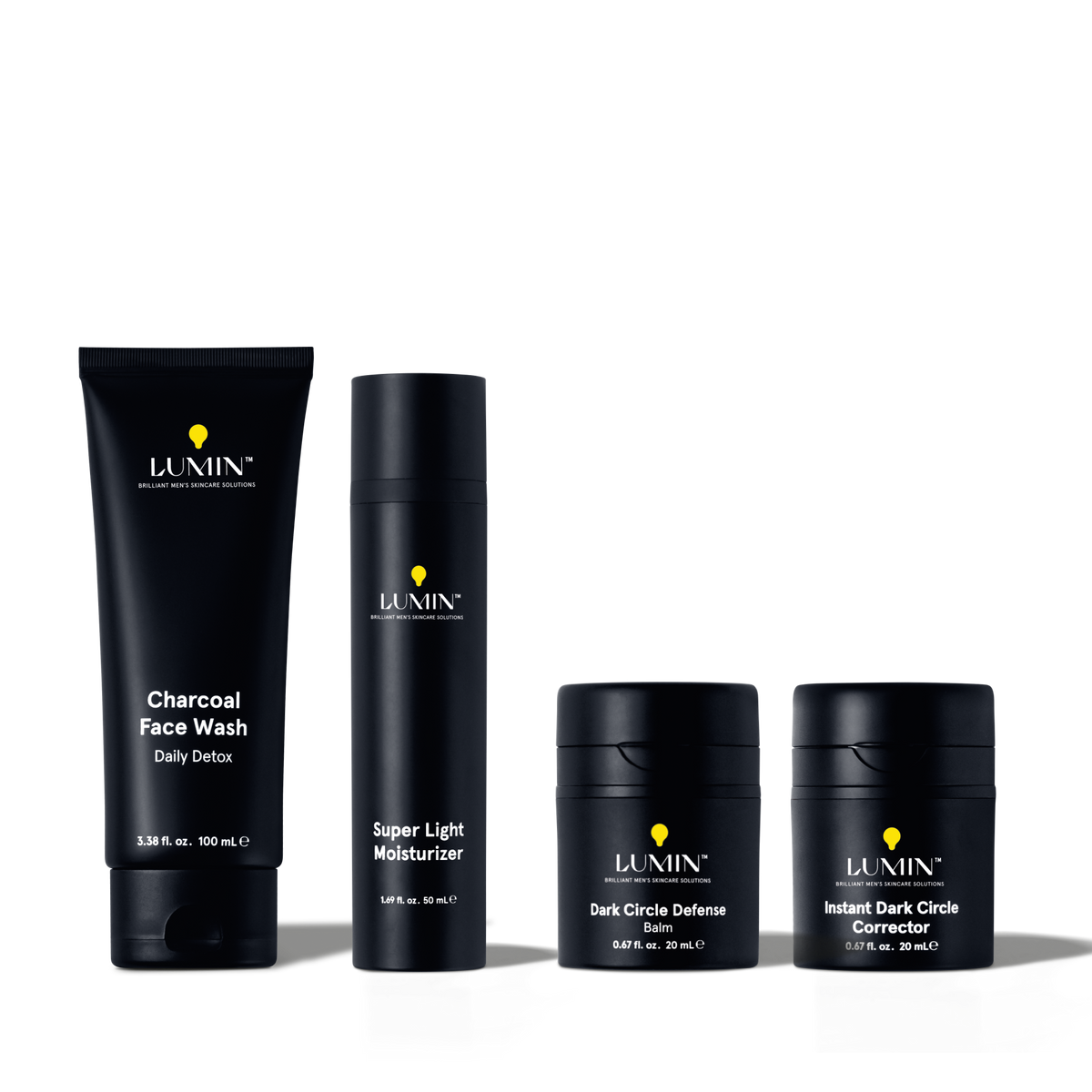 Lumin men's skincare set with charcoal face wash, super light moisturizer, dark circle defense balm, and instant dark circle corrector.