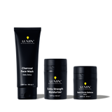 Lumin men's skincare set with Charcoal Face Wash, Extra Strength Moisturizer, and Dark Circle Defense Balm in black packaging.