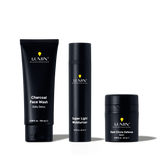 Lumin men's skincare trio with Charcoal Face Wash, Super Light Moisturizer, and Dark Circle Defense Balm in black packaging.