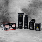Lumin men's skincare set with charcoal face wash, wrinkle defense serum, daily face moisturizer, dark circle defense balm, and LED eye massager.
