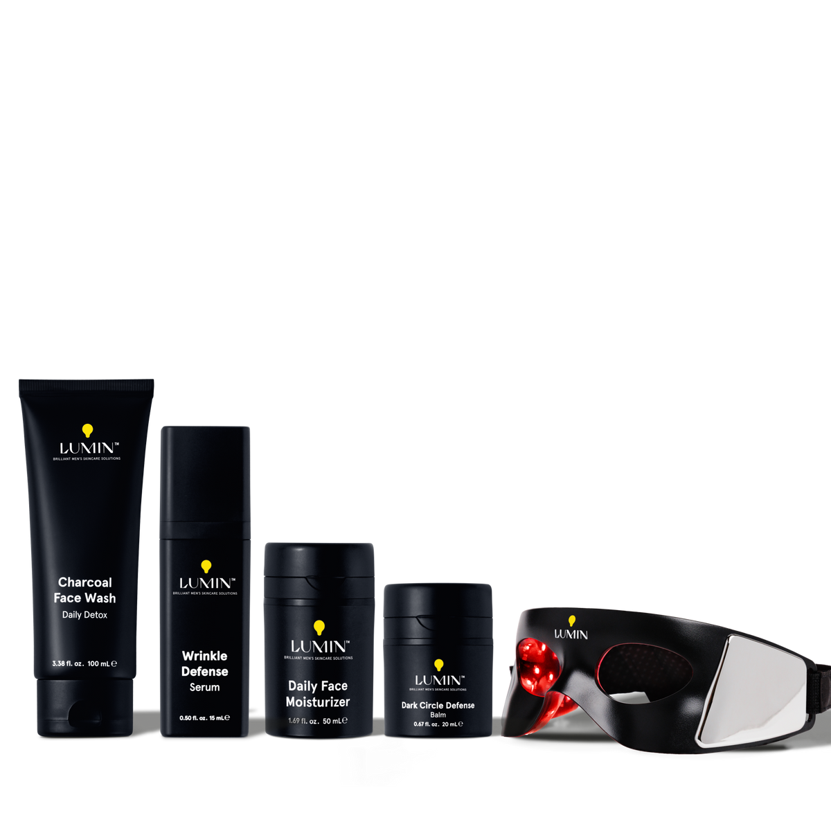 Lumin men's skincare set with charcoal face wash, wrinkle defense serum, daily moisturizer, dark circle balm, and LED eye mask.