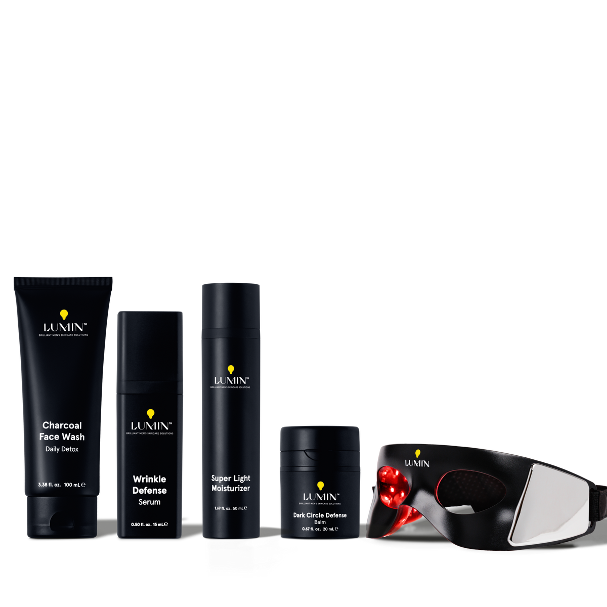 Lumin men's skincare set with charcoal face wash, wrinkle defense serum, moisturizer, dark circle balm, and LED light therapy mask.
