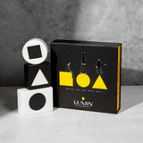 Lumin men's skincare Raise The Bar Gift Set with black and yellow box and geometric soap bars featuring circle, triangle, and square shapes.