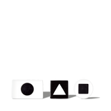 White and black geometric shape blocks with circle, triangle, and square cutouts on black background for educational use.