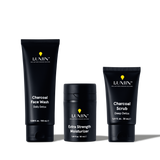 Lumin men's skincare set with Charcoal Face Wash, Extra Strength Moisturizer, and Charcoal Scrub for detox and hydration.