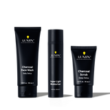Lumin men's charcoal skincare set with face wash, super light moisturizer, and deep detox scrub in black packaging.