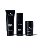 Lumin men's skincare set with Charcoal Face Wash, Wrinkle Defense Serum, and Daily Face Moisturizer in black packaging